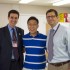Principal Evan Glazer (left) and Assistant Principal Shawn DeRose (right) surprised rising senior Brandon Kim (center) in his fourth period exam period when they announced that his submission had won the One Question contest.