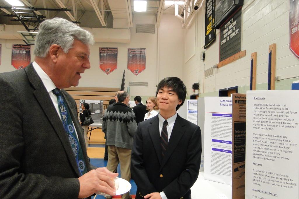 Senior+Shawn+Tsutsui+presents+his+project+to+Superintendent+Jack+Dale.+