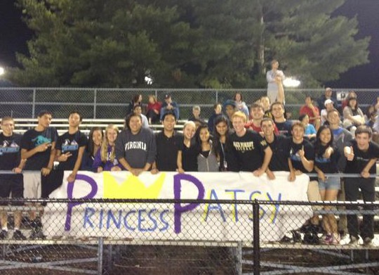 Devoted fans cheer on the Colonials at away game