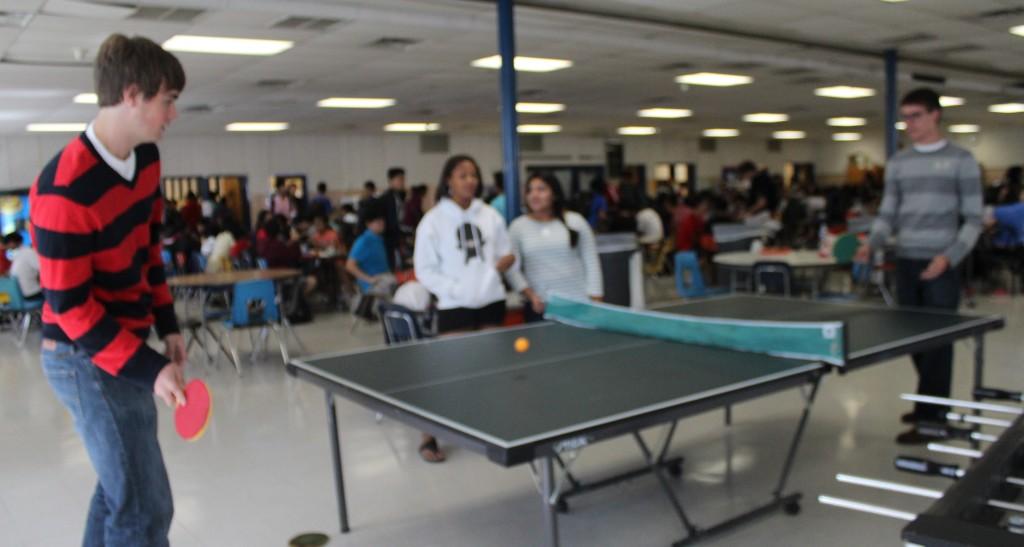 Seniors Joe Nissen and Nate McLean play ping-pong in slounge