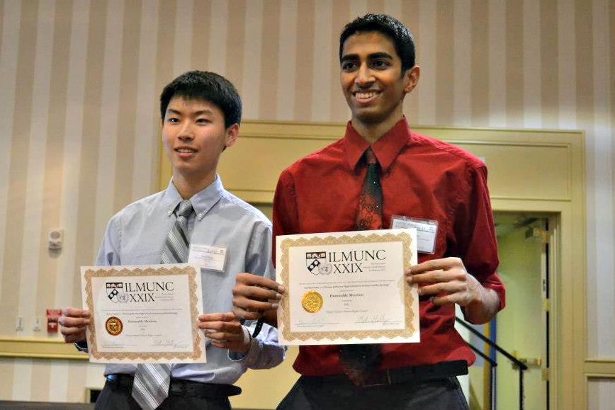 Seniors Keven Zhang and Sarthak Sahu display their awards at ILMUNC.