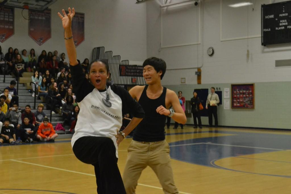 'Dancing with the Faculty' champions, Spanish teacher Alexandra Pou and junior Eric Xie, show off their dance moves at the Winter Sports Pep Rally.