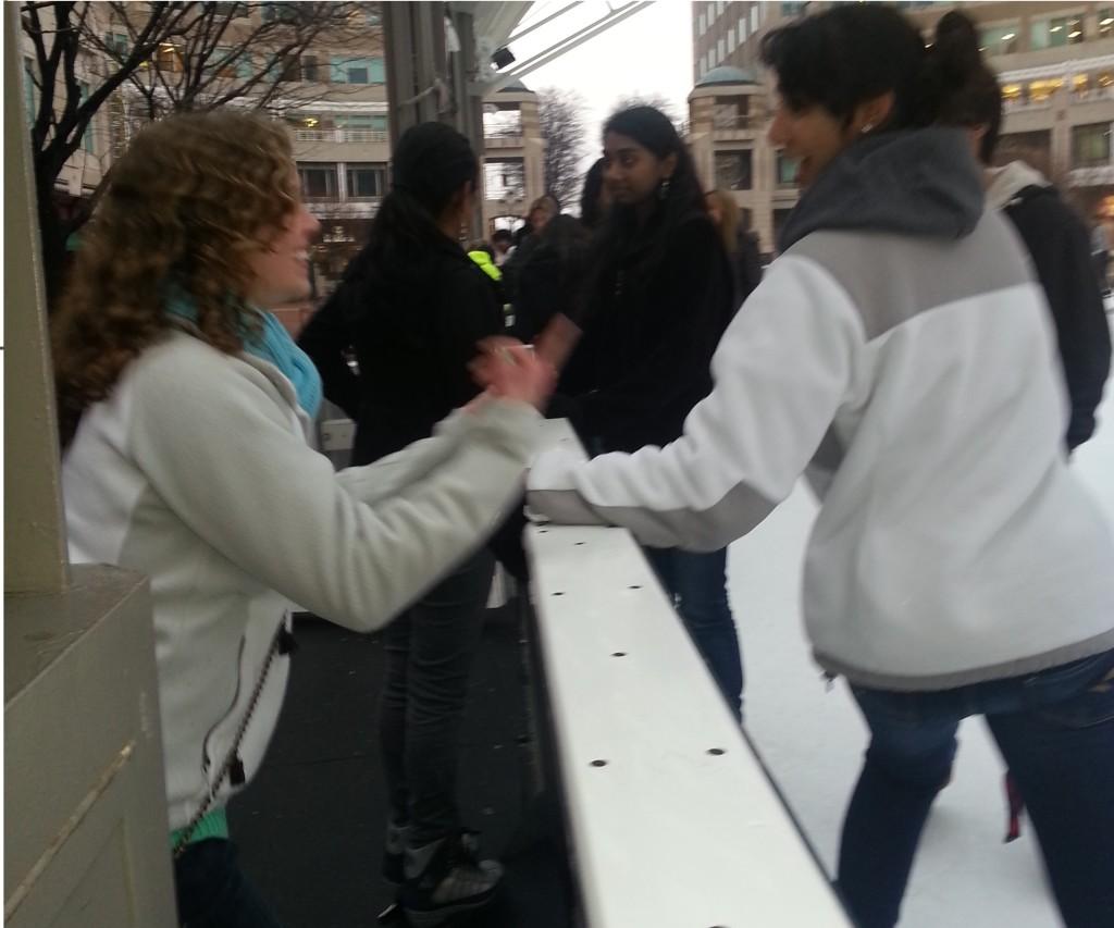Juniors Meena Rezazad and Catherine Vallery converse at the Ice Skating Pavilion at Reston Town Center.