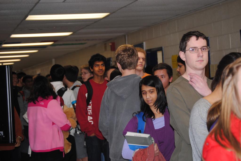 Students fill the hallways outside of the library in an effort to purchase a ticket before they are sold out.