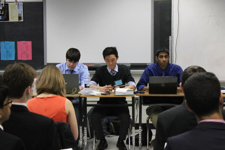 Seniors Zach Moser, Andy Kim and Sarthak Sahu chair the Arab League committee at TechMUN.