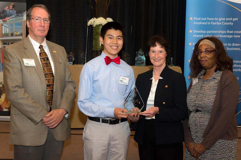 Senior Kevin Cao accepts his award at the Celebrate Partnerships Award Ceremony. Photo courtesy of FCPS.