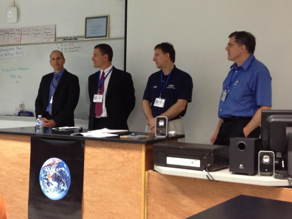 Alan Miller, Peter Rochford, Lloyd Whitman and Brian Becker introduce themselves to the students in the "Research and Development" TjSTAR panel.