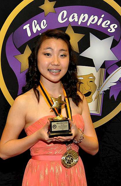 Junior Yena Seo receives a trophy for winning the Comic Actress in a Play award at this year's Cappies Gala.