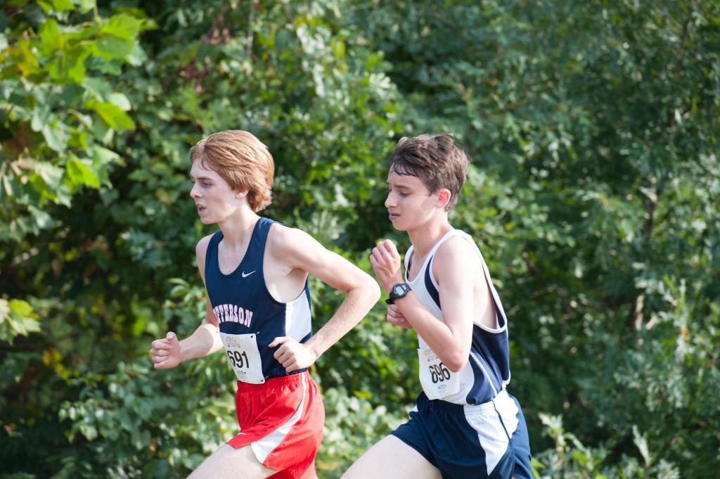 At the PR Kickoff Invitational, sophomores Nate Foss and Eli Lifland pace each other during the sophomore boys race.