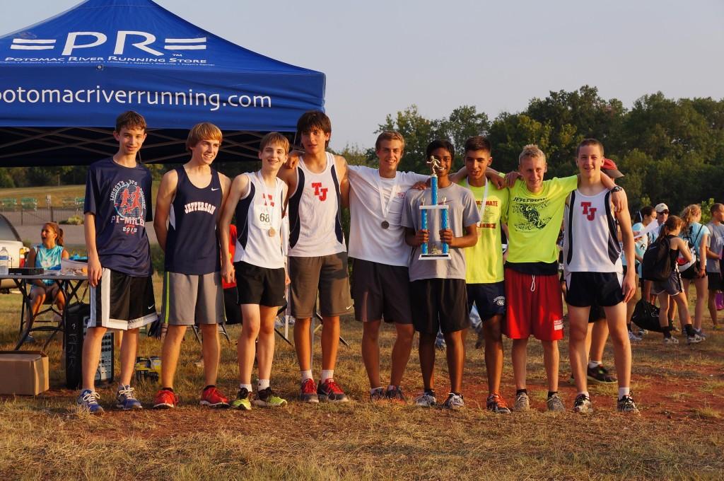 (Left to right) Sophomores Eli Lifland and Nate Foss, freshmen Will Baxley and Giancarlo Valdetaro, senior Matt Wattendorf, freshman Saurav Velleleth, senior Zartosht Ahlers, junior Chris Blagg, and senior Andreas Butler accept the trophy awarded to the fastest team.