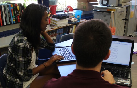 Seniors Sib Shewit (left) and Ricardo Tucker (right) get to work during their first day of broadcast journalism.