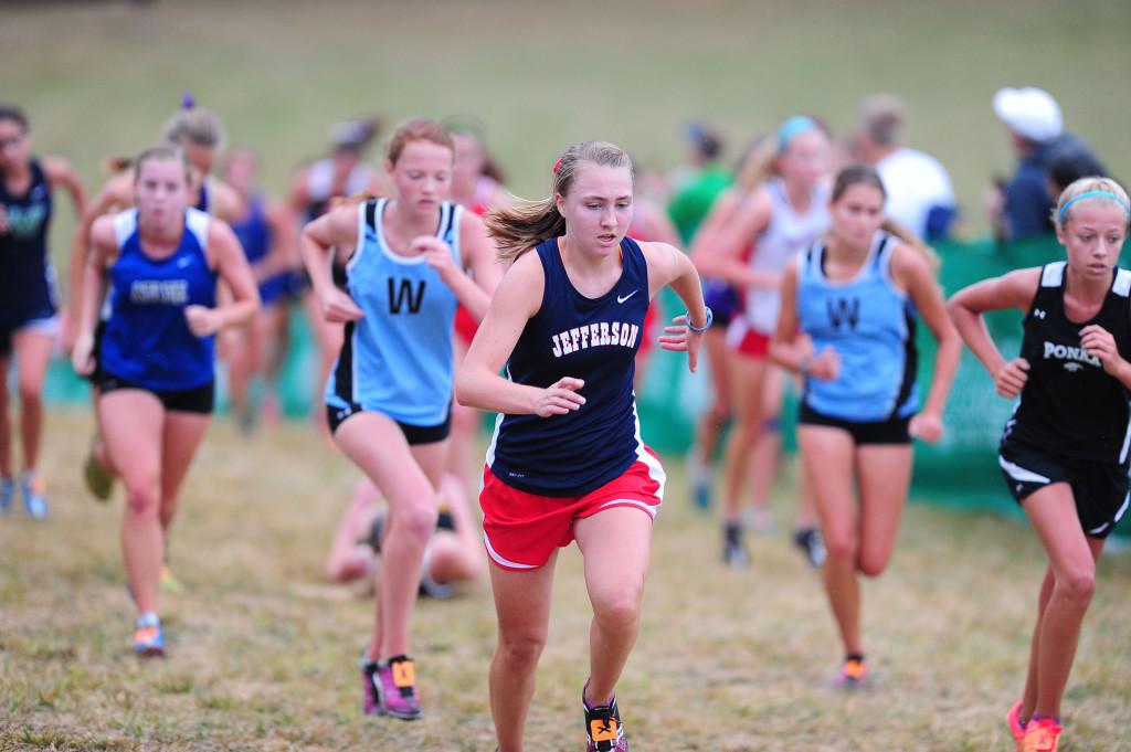 Junior Haley Stumvoll fights her way up the infamous "Wall" in the Varsity A girls race.