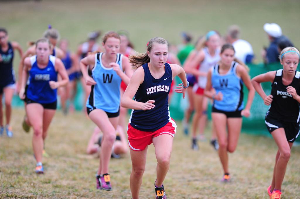 Junior Haley Stumvoll fights her way up the infamous Wall in the Varsity A girls race.