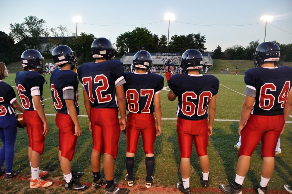 Jefferson football players watch their teammates during the game.