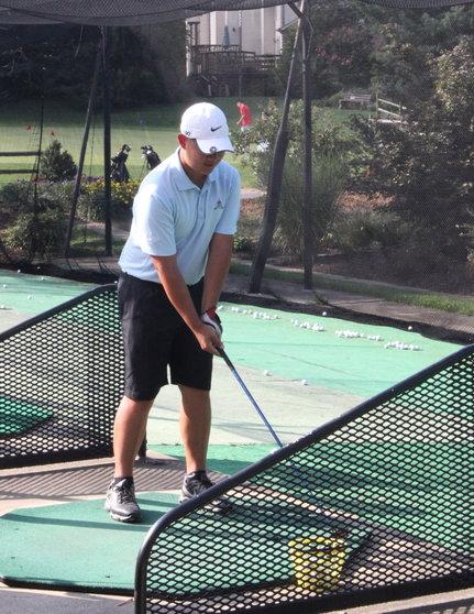 Senior co-captain Chris Prak practices his swing at Pinecrest Golf Course on Sept. 3.