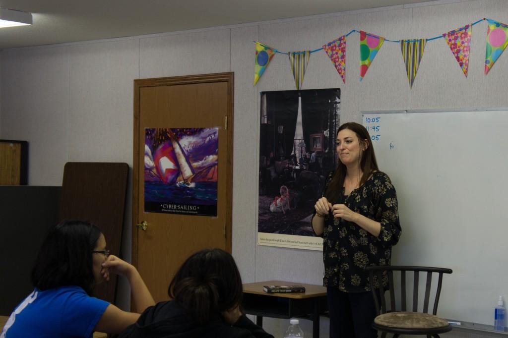 Students+listen+as+debut+author+Elisa+Nader+talks+about+her+writing+experience.