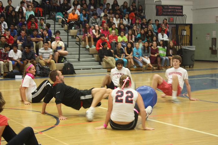 Jefferson students battle against their teachers to win the crabwalk soccer match.