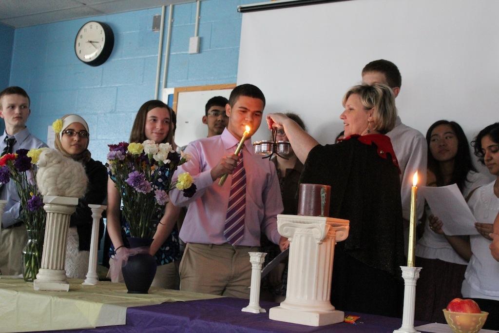 Pro-Consul+Anthony+Carrington+lights+the+candles+for+the+LHS+Induction+Ceremony.