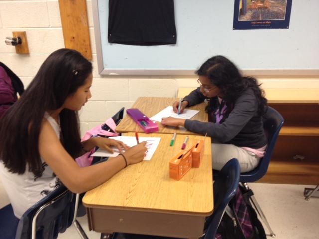 Students create fliers to promote UNICEF's Hunger Banquet, an event that will be held on Nov. 1.