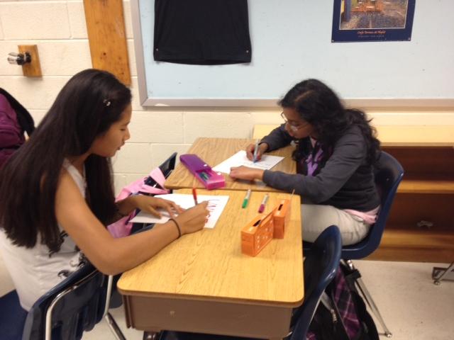 Students create fliers to promote UNICEFs Hunger Banquet, an event that will be held on Nov. 1.