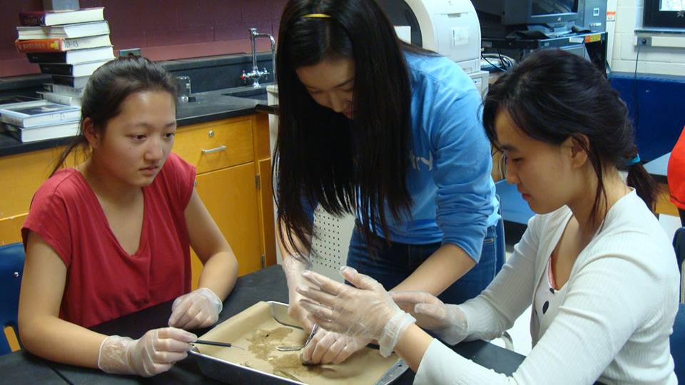 Juniors Jennifer Fang, Janie Choi and Joo Kang learn how to dissect a cow's eye. Photo by Esther Kim.