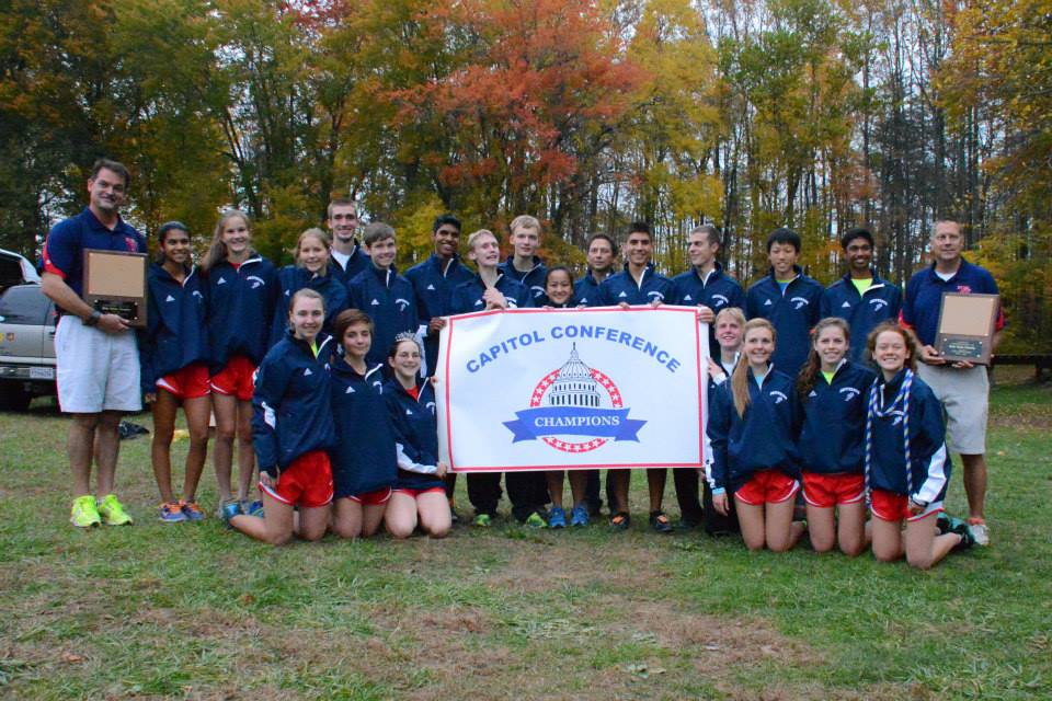 At the Conference 13 district meet, the cross country team took home a double win. Photo courtesy of Sally Stumvoll.