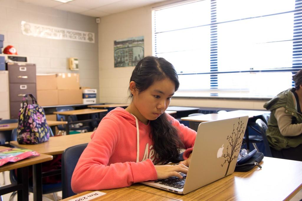 Freshman+Emma+Zhang+works+intently+on+her+novel+at+NaNoWriMo+Club.