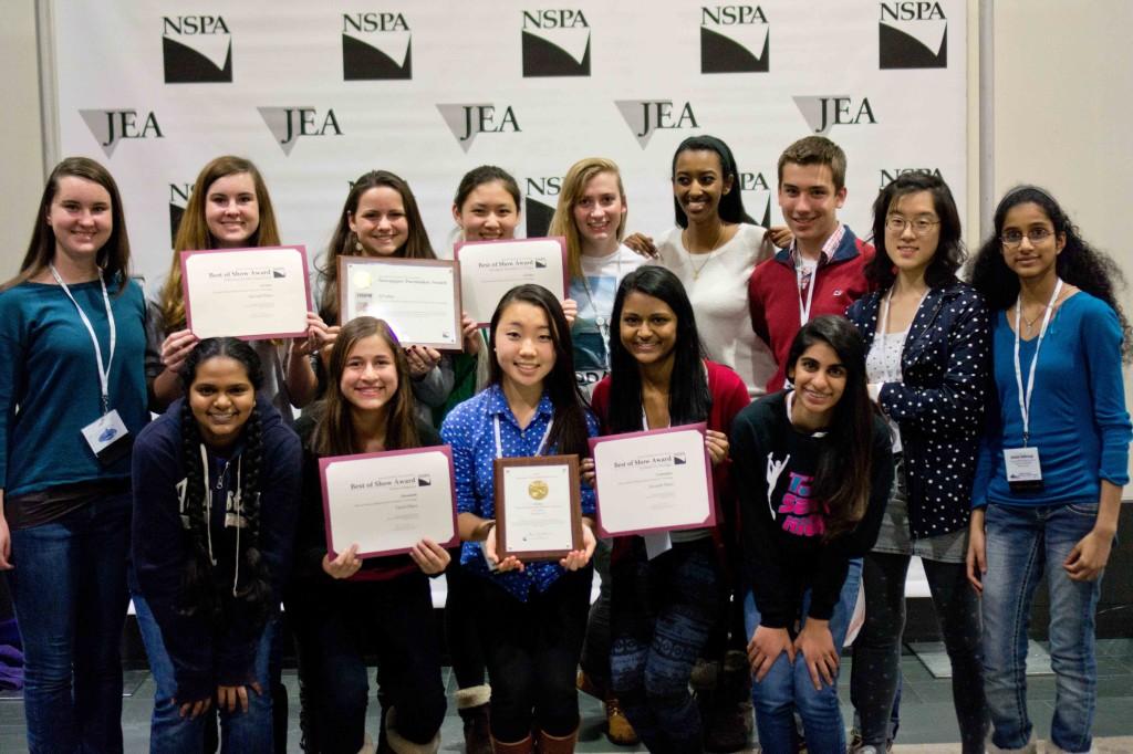 The staff of tjTODAY and Technique stand with the awards received at the Journalism Education Association (JEA)/National Student Press Association (NSPA) Fall National High School Journalism Convention from Nov. 14 to 17. Photo by Ellen Kan.