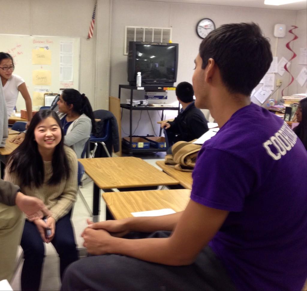Co-founder Keshav Rao (right) discusses goals of "What's Up Education" during the eighth period interest meeting.