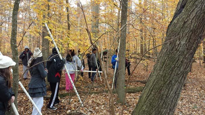 IBET students work on surveying Elizabeth Hartwell Mason Neck National Wildlife Refuge for their projects.