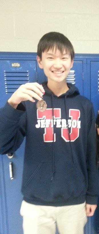 Sophomore Kevin Xu places sixth in varsity public forum debate.