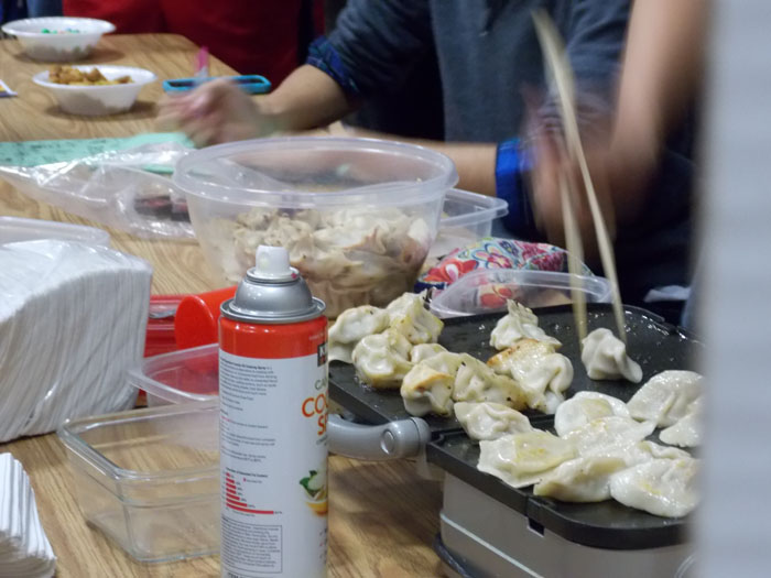 Chinese students make dumplings for the Winter language festival.