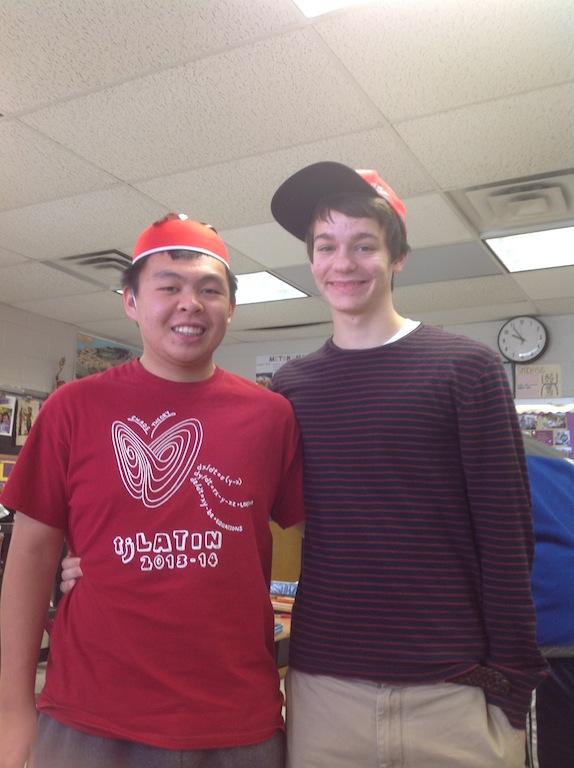 Juniors George Ho and Jack Morris show off the gifts they received for Saturnalia.