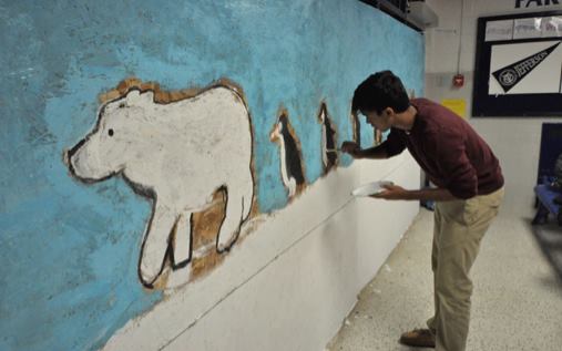 Sophomore class president Kunal Naik spruces up new sophomore lounge with paintings.
Photo courtesy of Andy Zhao