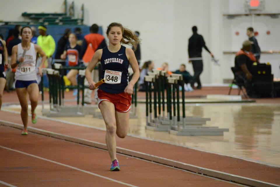 Junior Katrina Junta races as the second leg of the girls' 4x800 relay team. The relay placed fourth and barely missed qualifying for States.