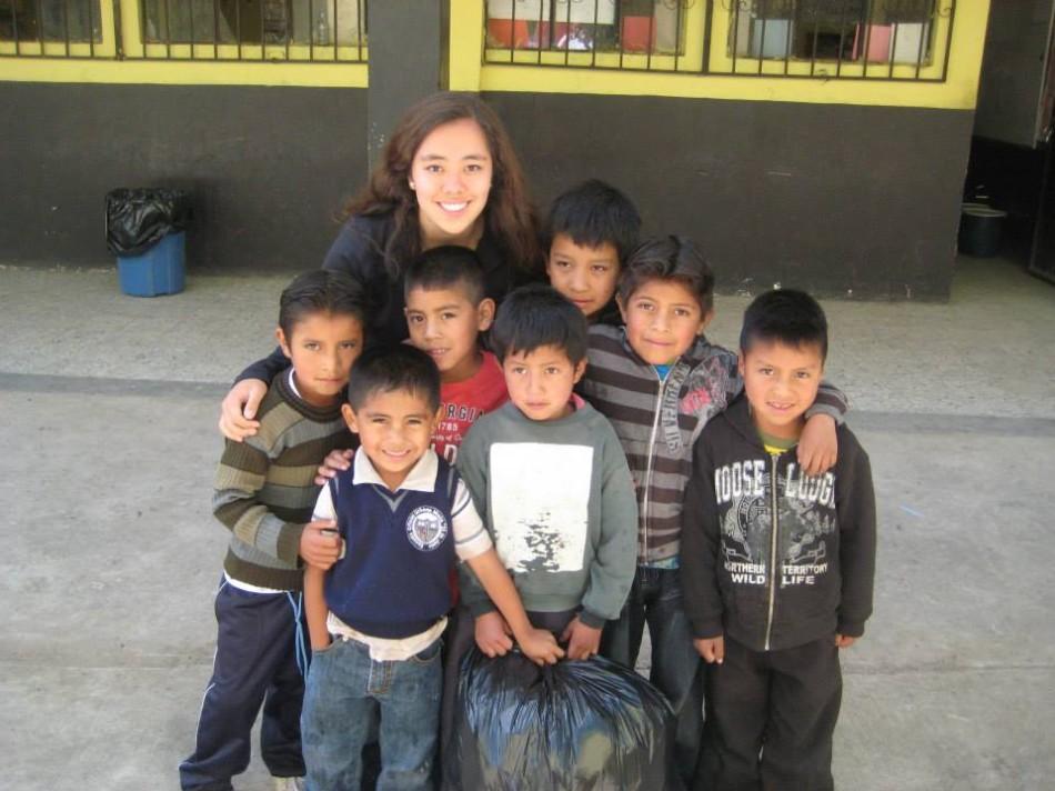 Junior Sage Teasley stands with Guatemalan children from her trip to Guatemala with the Global Public Service Academies (GPSA) for Health during the summer of 2013. Photo courtesy of GPSA.