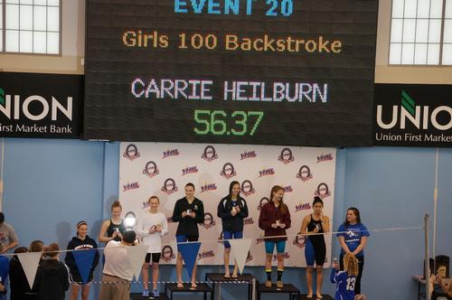 Photo courtesy of www.colonialathletics.org.
Junior Carrie Heilbrun stands on the podium after winning 100 backstroke at the state conference.