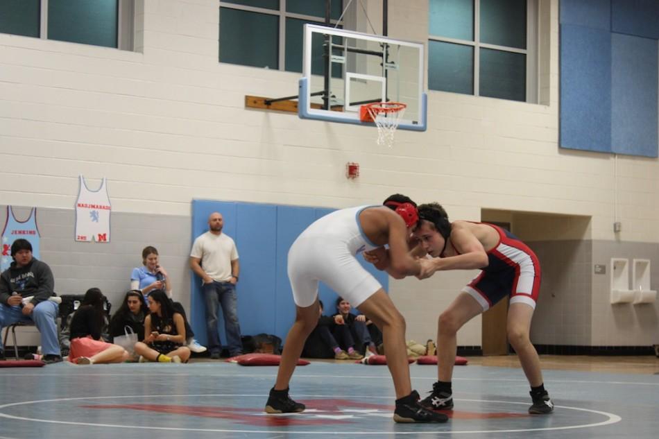 Photo+by+Anjali+Khanna.%0AFreshman+Andrew+Yoder+wrestles+in+the+last+varsity+game+of+the+season+against+Marshall+High+School.+