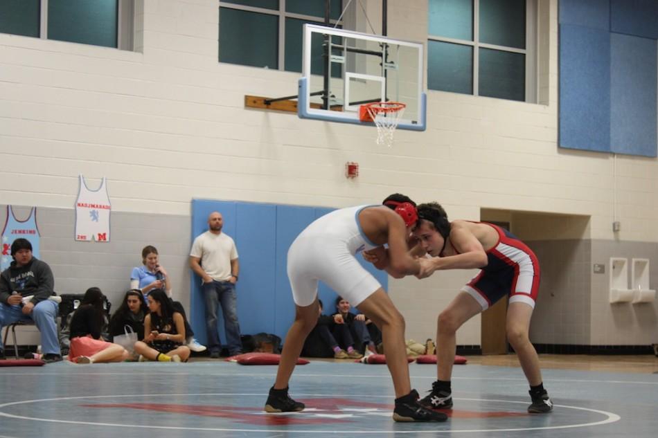 Photo by Anjali Khanna.
Freshman Andrew Yoder wrestles in the last varsity game of the season against Marshall High School. 