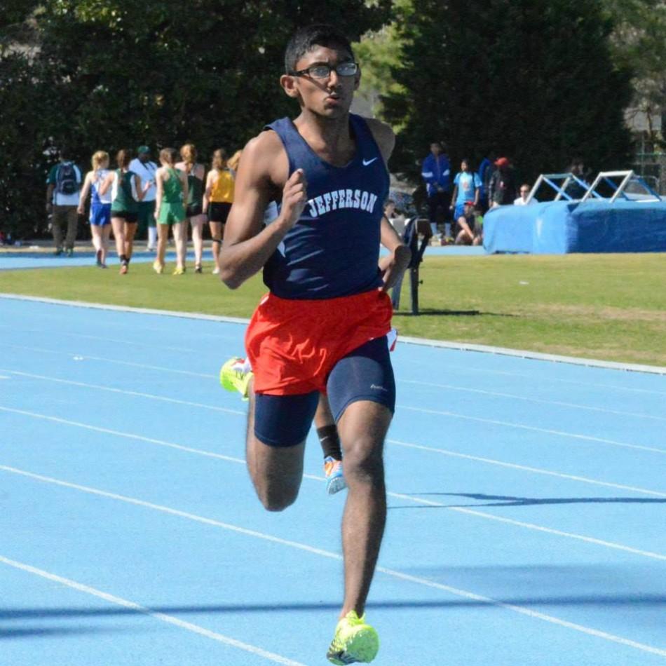 Senior Muthu Chidambaram races to a third place finish in the 200-meter dash. He also won the triple jump.