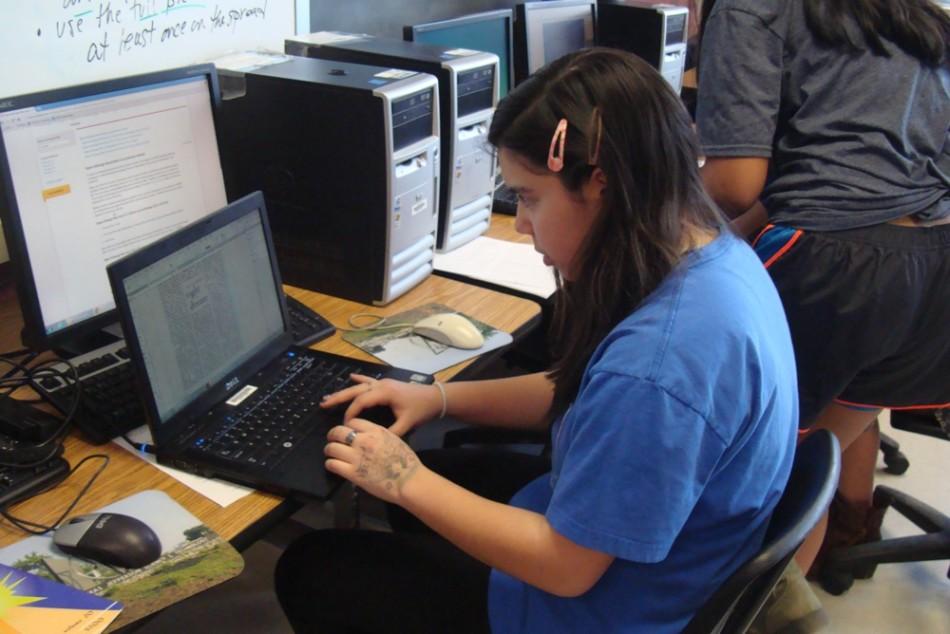 Sophomore Gabriela Huckabee works on her spread that will be published in the upcoming Threshold magazine.