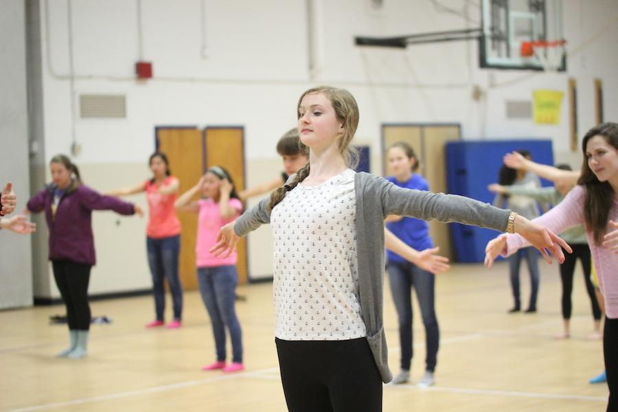 Junior Sarah Falls stretches in yoga during B block of eighth period on April 30.