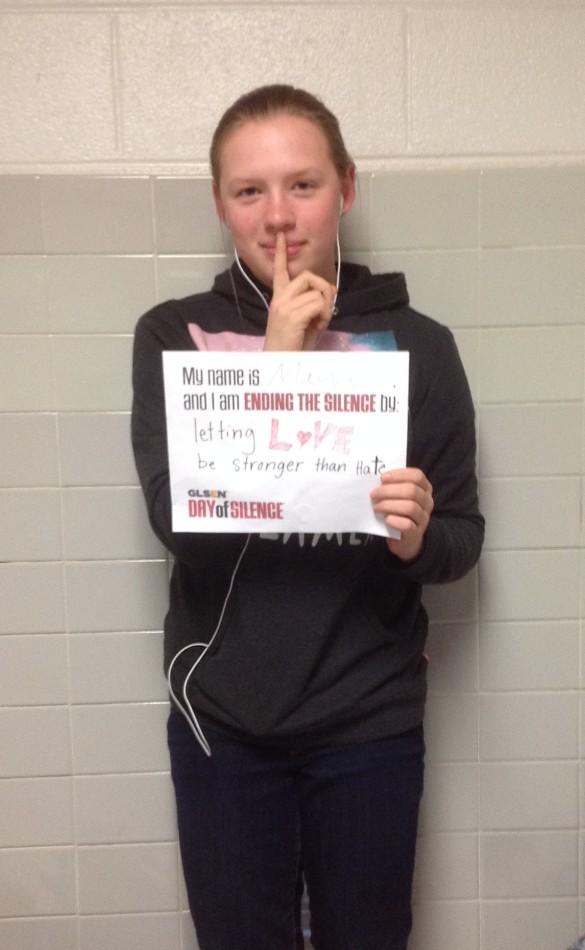 Sophomore Max Pabilonia holds a sign explaining Jeffersons Day of Silence on April 11.