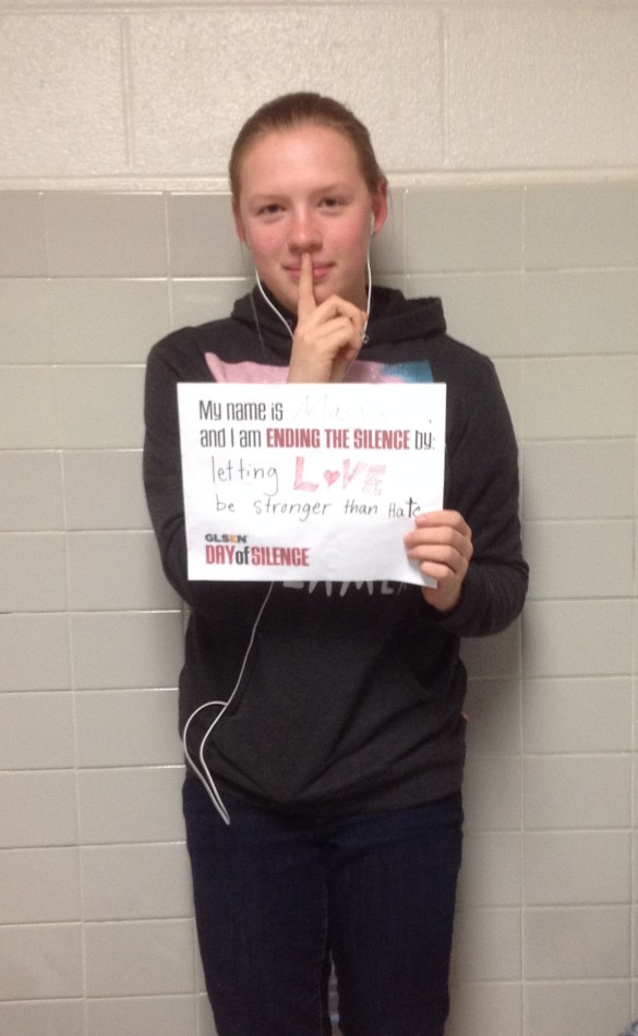 Sophomore Max Pabilonia holds a sign explaining Jefferson's Day of Silence on April 11.