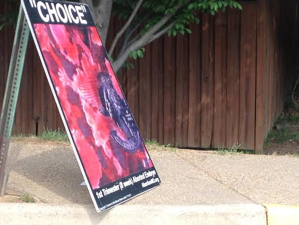 One of many CBR Maryland posters picketed outside Jefferson on Thursday, May 22. 