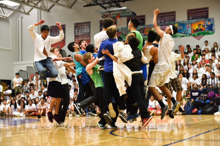 Senior MEX dancers explode out of formation at the end of Gonna Fly Now, the theme song from the movie Rocky.