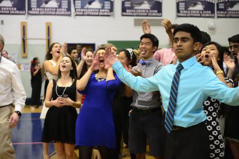 Left to right: Seniors Anna Tursi, Aleesha Toteja, Justin Sun and Nihar Gudiseva cheer.