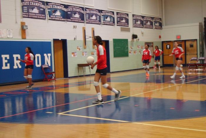 Members of Jefferson's freshmen volleyball team practice before playing against Fairfax High School on Sept. 23.