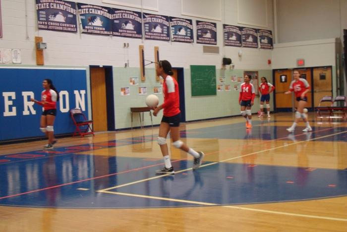 Members of Jeffersons freshmen volleyball team practice before playing against Fairfax High School on Sept. 23.