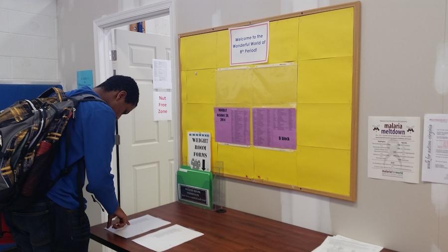 Sophomore Samuel Kebadu checks the list of students required to attend Administrative Study Hall on Oct. 20.